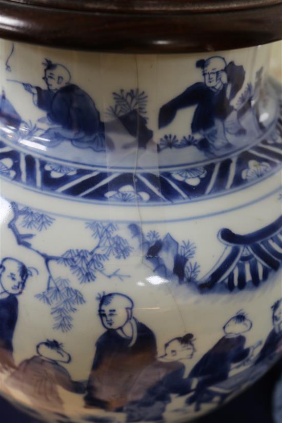 A Chinese blue and white Hundred Boys vase, Transitional period c. 1640, wood stand and cover